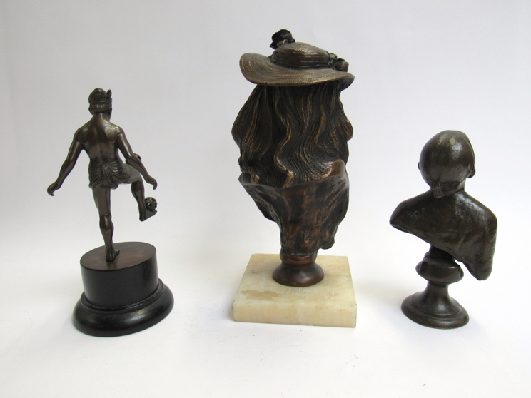 Three bronze figures, including two female busts and an Eastern ball balancer, 24,