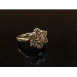 An 18ct white gold diamond daisy ring, 1.50ct total approx. Size H, 5.