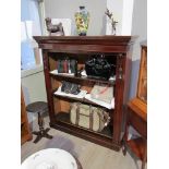 A circa 1860 mahogany bookshelf with carved foliate acanthus leaf corbel decoration and height