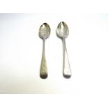 Two Thomas Wallis II silver serving spoons with bright cut decoration and monogrammed handles bowl