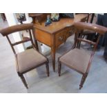 A set of six (4+2) Regency style mahogany dining chairs with carved back rest bar over turned and