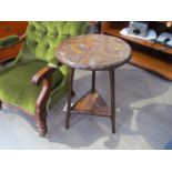 A circa 1900 Japanese two tier circular top lamp table with carved chrysanthemum and stem decorated