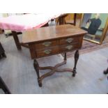 A Georgian walnut lowboy with two over one drawers,