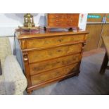A French burr and figured walnut four drawer chest with key having corbel and reeded decoration