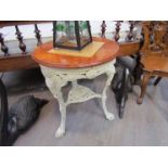 A Victorian cast iron pub table with mahogany top,