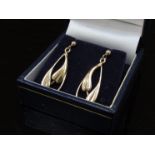 A pair of 9ct gold stylised leaf design earrings, 4.