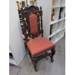 A pair of Victorian carved oak hall chairs with upholstered back & seat