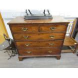 A George III mahogany chest of two short over three long drawers, bracket feet, small proportions,