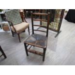 A set of four early 19th Century ladder-back rush-seated dining chairs