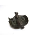 A cast metal Oriental female ashtray with surprise verso!!! 12cm wide