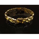 A gold bracelet stamped 750, 19cm long, 24.