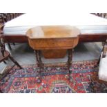 A Victorian walnut lady's writing table with lift-up top revealing writing space letter rack and