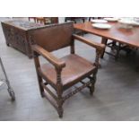 A set of Cromwellian style dining chairs with leather backs and seats, stud detail,