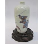 An Oriental miniature vase with figural hunting scenes, heavily restored