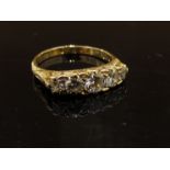 An 18ct gold five stone graduated diamond ring, 1.30ct total. Size Q, 4.