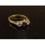 An 18ct gold ruby and diamond ring. Size L, 3.
