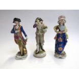 Three continental porcelain figures including drummer and gent with bouquet of flowers, 17.