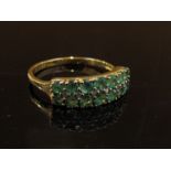 A 9ct gold emerald and diamond dress ring.