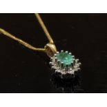 An emerald and diamond pendant hung on a 375 stamped chain, 46cm long, 2.