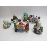 Five 20th Century ceramic Oriental figures including drum form container and Chinese made