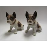 A pair of early 20th Century porcelain Pug dog figures,