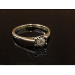 A 9ct white gold diamond solitaire. Size J, 1.