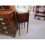 A George III flame mahogany single door pot cupboard on fine tapering square legs,