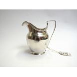 A George III silver milk jug a Fogelbus,