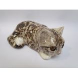 A Winstanley recumbent tabby kitten, 7cm tall, 19cm long,
