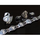 A suite of Siam Niello jewellery, bracelet, brooch, ring, earrings marked sterling, 19.