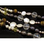 An opera length rope of natural pearls mixed with lemon citrines,