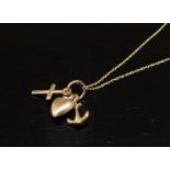 A necklace stamped 14k hung with three charms, 44cm long,