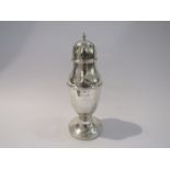 A silver sugar caster, weighted base, marks rubbed, dents present,