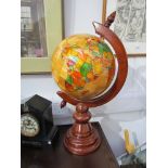 A specimen wood table top world globe,