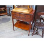 A Maple & Co Edwardian flame mahogany bow front lowboy the two short and single long drawer on
