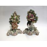 A pair of late 19th Century Bocage figures, musicians with gold anchor, mark to back 21.