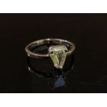 A white gold diamond ring, the trillion yellow diamond 1.19ct, stamped 750. Size N, 2.