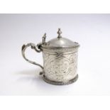 A Victorian silver mustard W E London 1856 with urn finial, engine-turned body and cover,