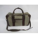 GUCCI Vintage 1970's soft body luggage case. brown canvas body with GG monogram.