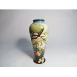 A Moorcroft Rock a bye Baby pattern vase, designed by Nicola Slaney, 21cm tall,