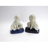 A pair of Victorian Staffordshire poodle pups,