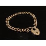 A rose gold bracelet with padlock clasp, stamped 9C,