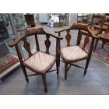 A pair of mahogany corner chairs