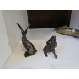Two bronze seated hares, 6.