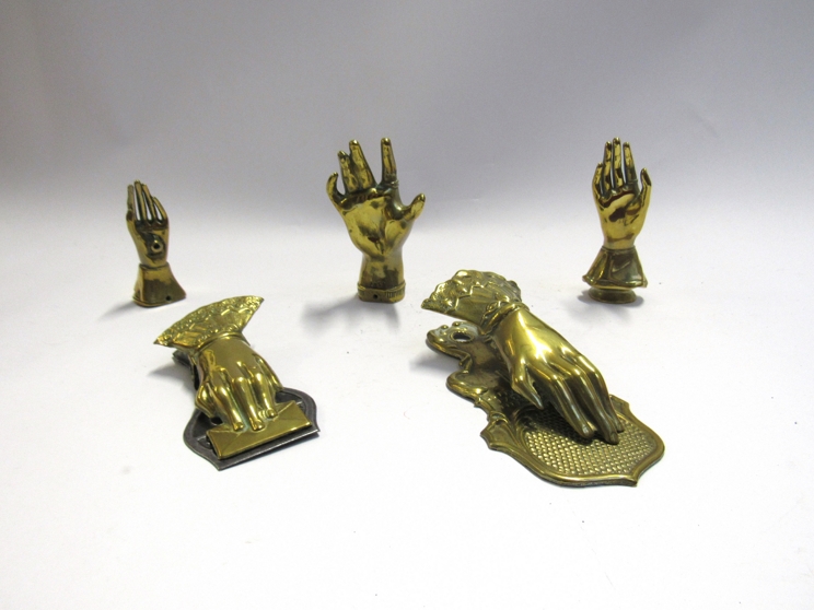Five various brass hands including note holders