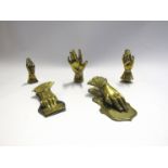 Five various brass hands including note holders