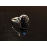 An oval Blue John set ring, stamped silver. Size Q, 3.