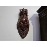 A carved African mask,