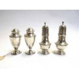 Two pairs of modern silver pepperettes the first William Comyns & Sons London 1926;