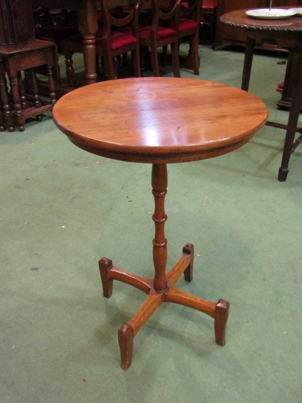 A country pine wine table with turned column and quatreform base,